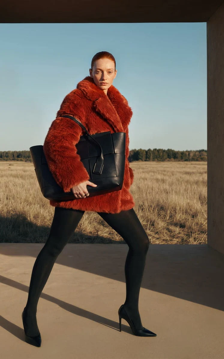 Velva outerwear campaign image shot in an open field