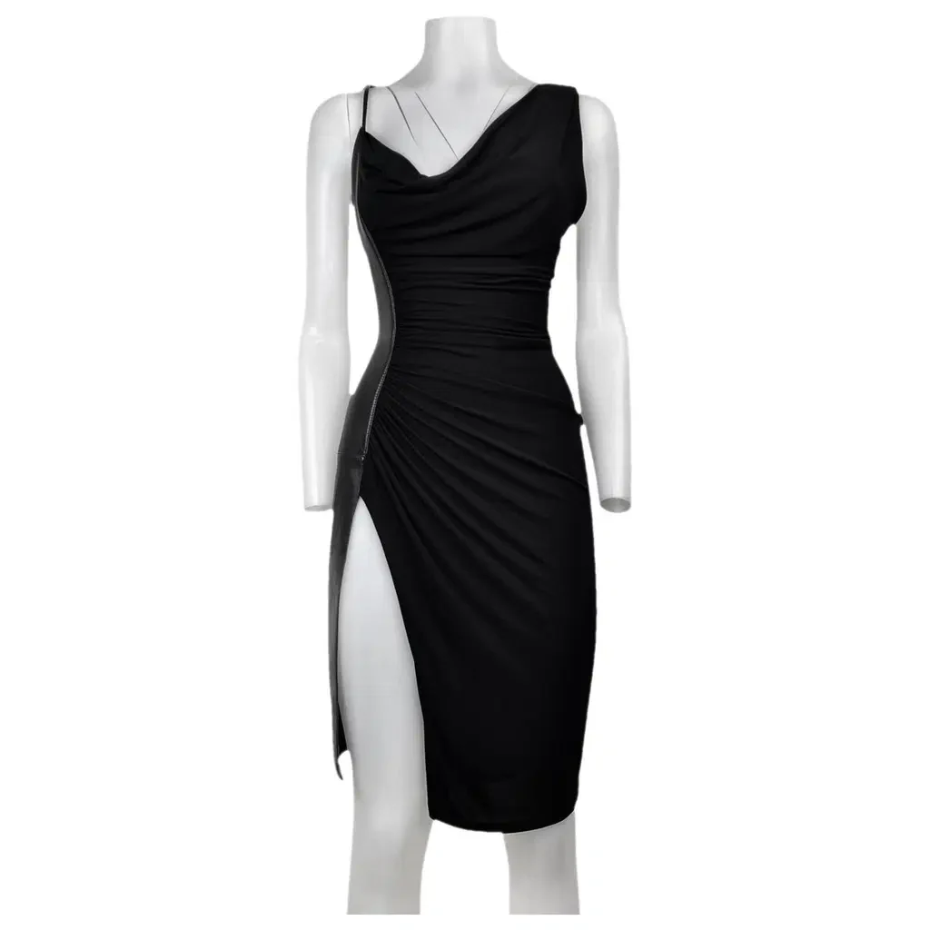 A draped black dress dressed on a white mannequin, front on