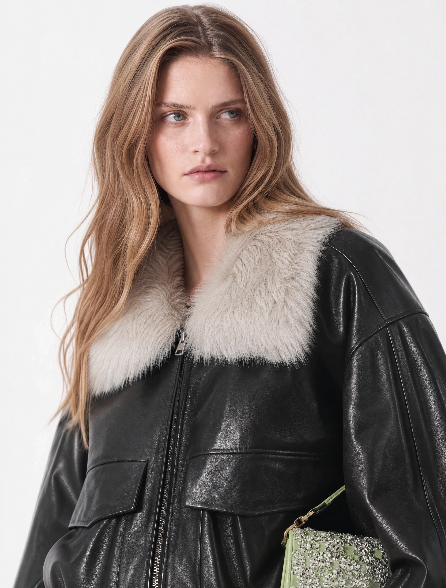 AI-generated on-model image: black leather jacket with a shearling collar, close-up portrait