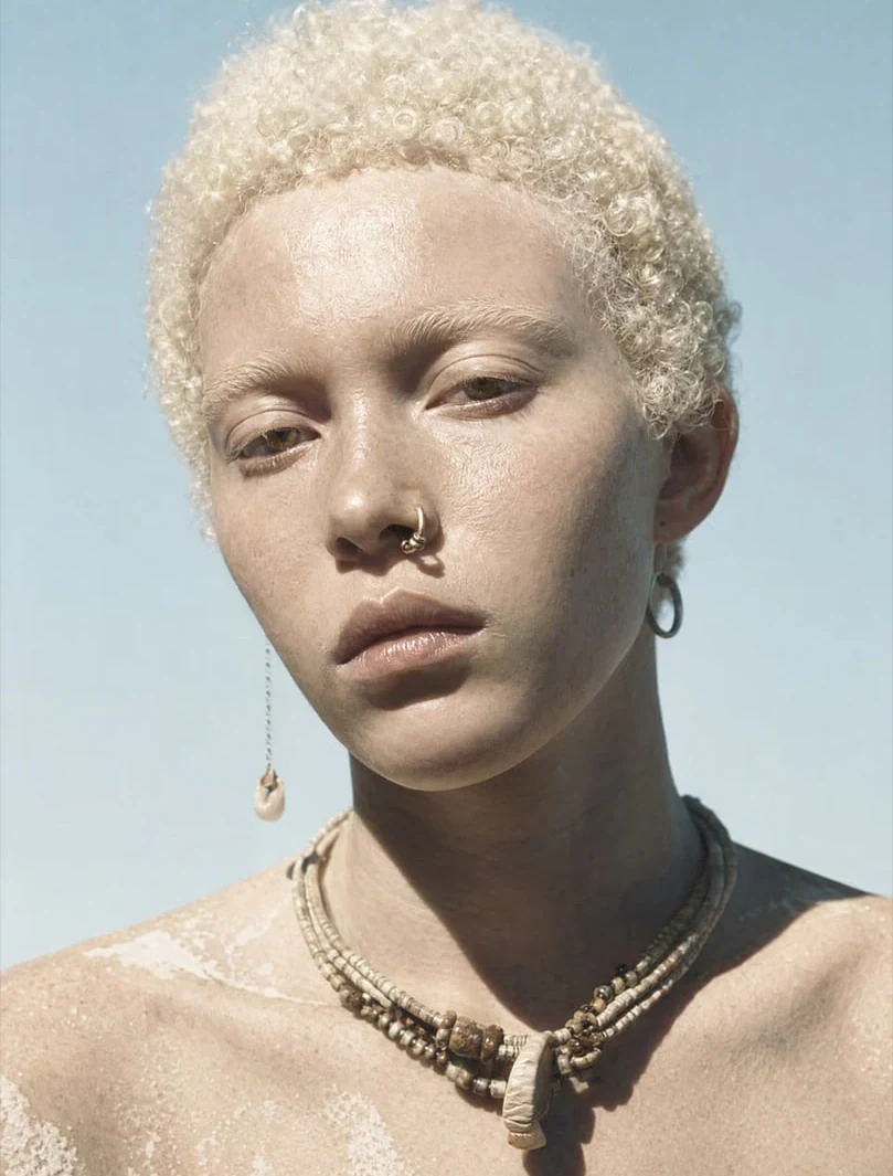 AI-generated on-model image: beauty portrait with beaded jewellery, close-up