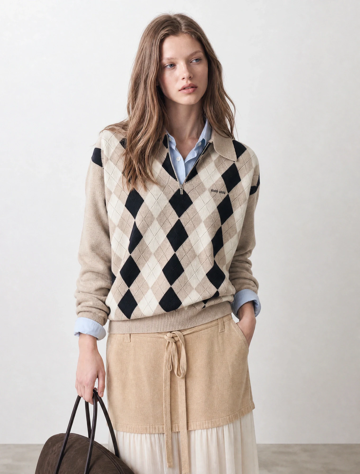 AI-generated on-model image: argyle knit vest over a shirt with a knit skirt