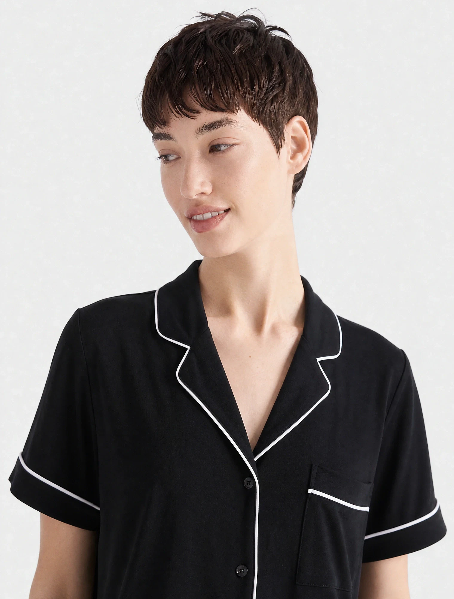 AI-generated on-model image: black piped shirt, front mid shot