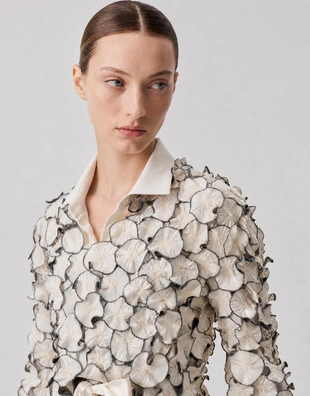 Sculpted blouse converted from a ghost mannequin shot to a live AI model video